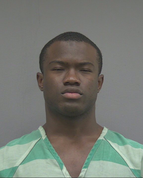 Booking photograph for TRAVIS T'JAY ROLLINS