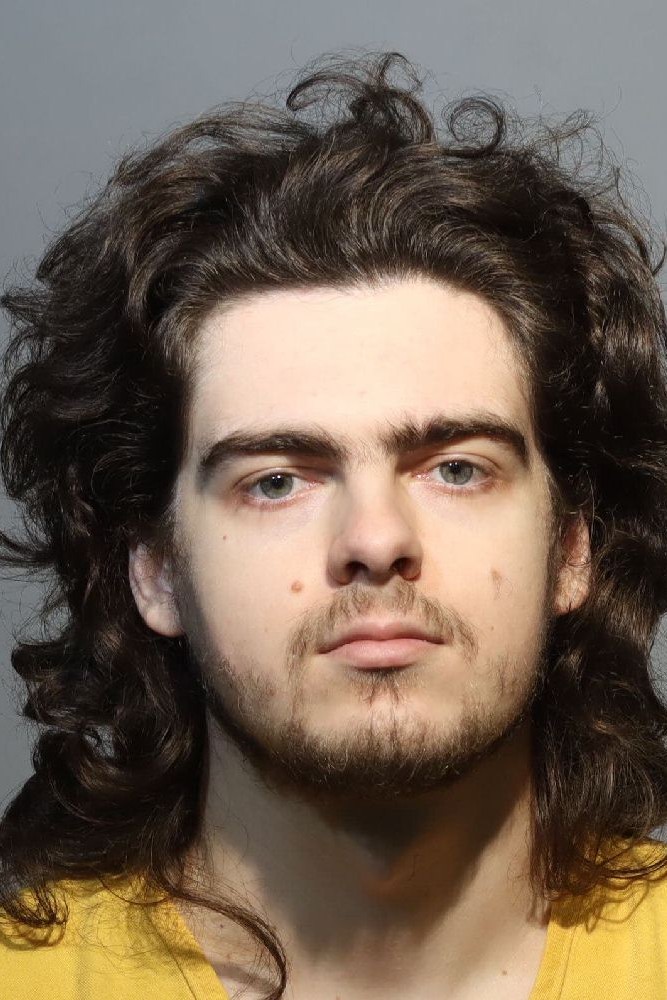 Booking photograph for TRAVIS RACO
