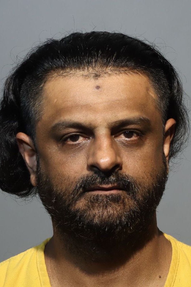 Booking photograph for MOHAMEDABBAS HASNAINHAMZAA NOORMAHAMED