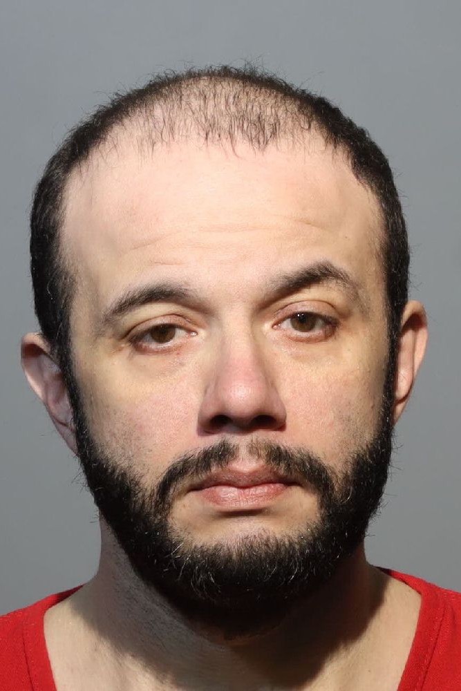 Booking photograph for JOEL ROSARIO