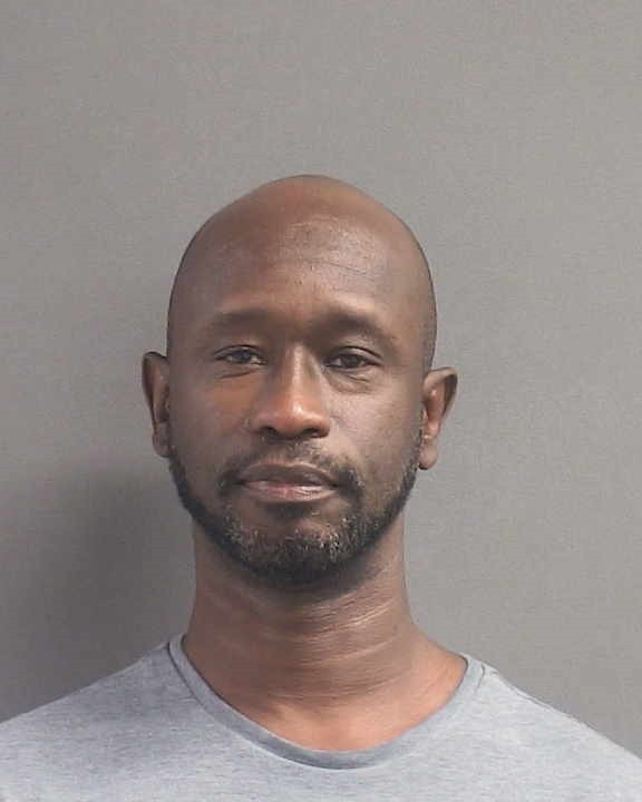 Booking photograph for ALPHA KUYATEH