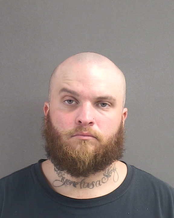 Booking photograph for AARON MIDIGAN