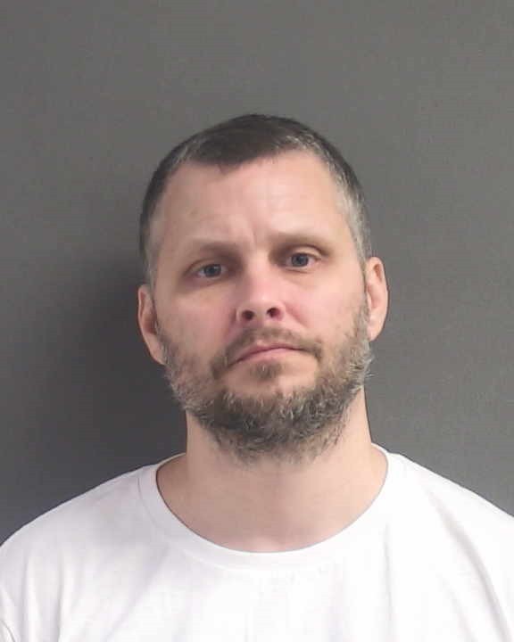 Booking photograph for JUSTIN TROY CARUTHERS