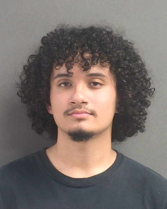 Booking photograph for JUSTIN HERIBERTO BARRIOS