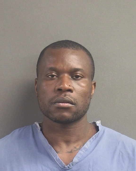 Booking photograph for MATHIEU MERVEIL KOUATONOU